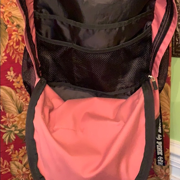 Pink back pack with large logo on bottom. - Picture 6 of 8